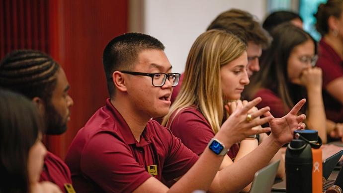 Danny Nguyen speaks at a leadership panel at an SGA meeting in the Fiesta Room