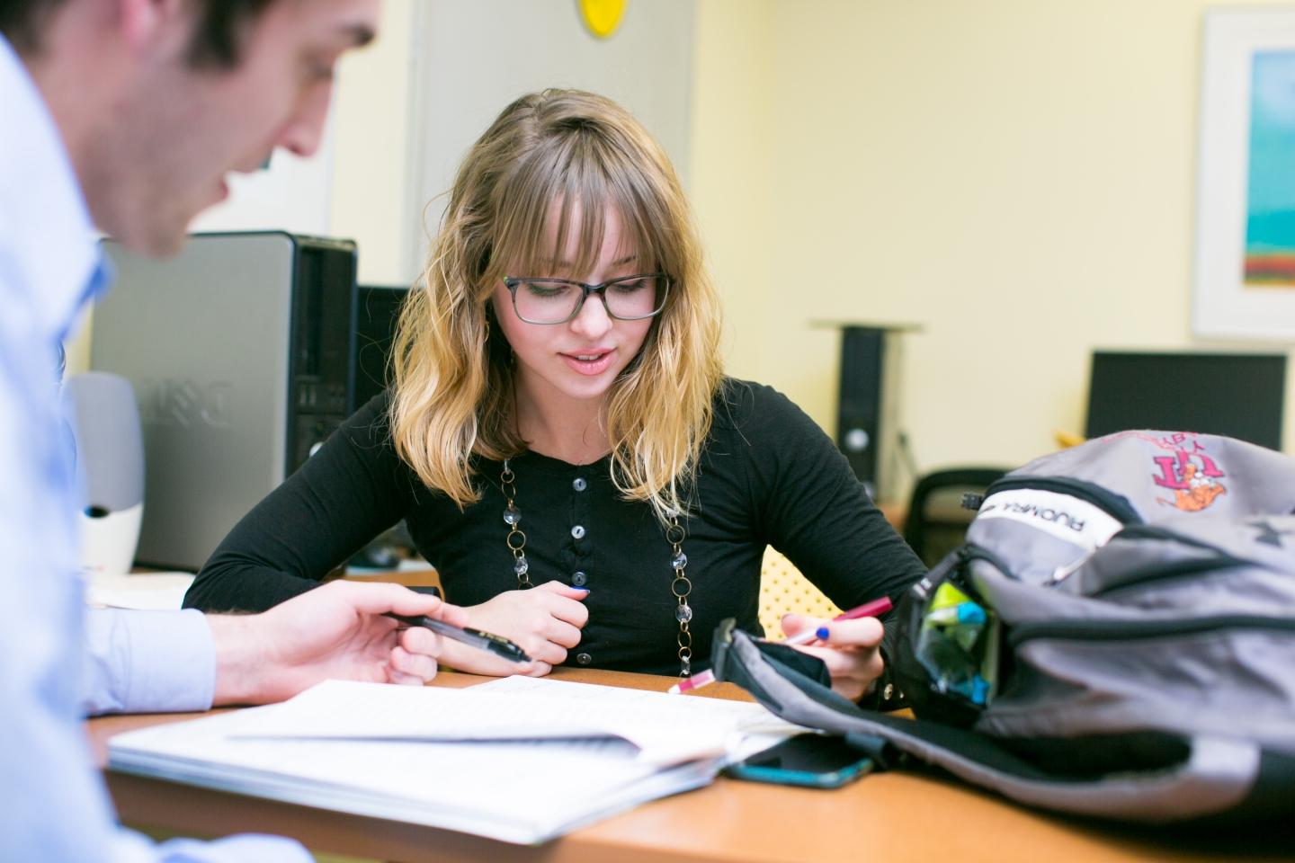 Student and mentor working together on a paper