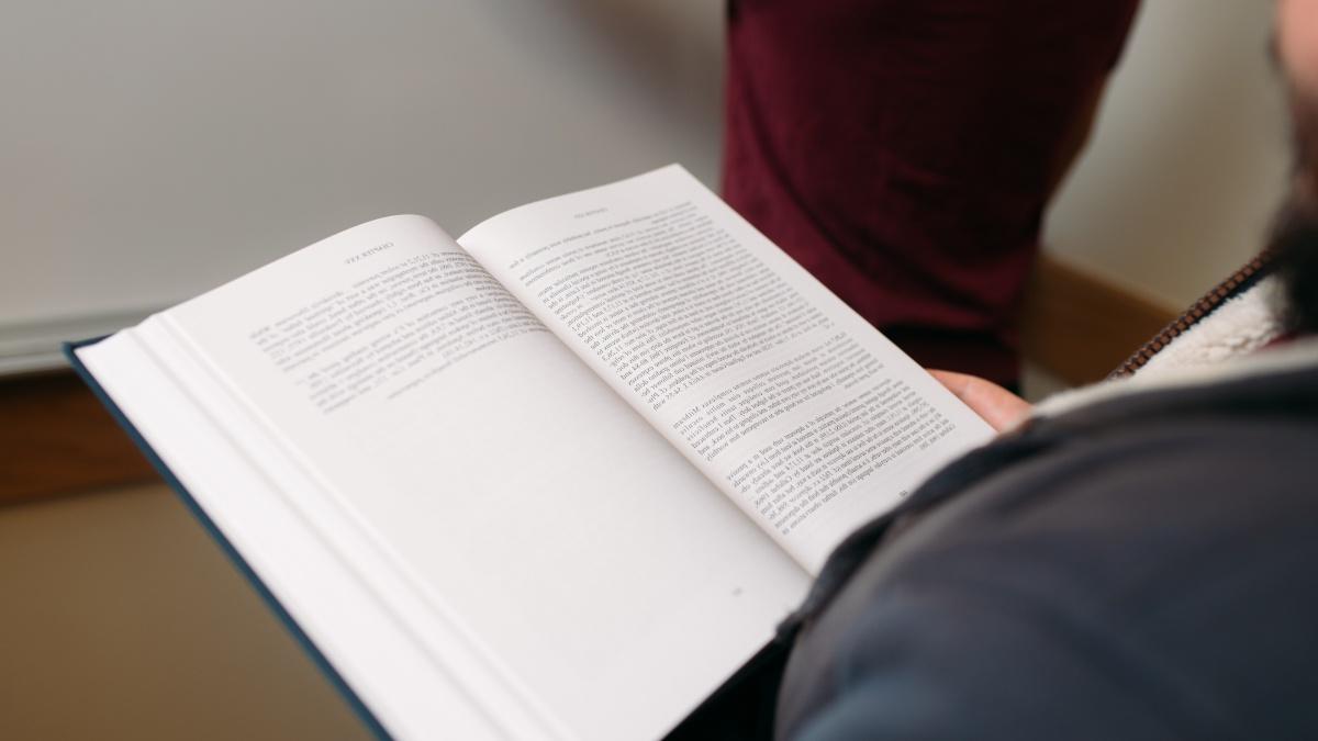 open book on a student's lap