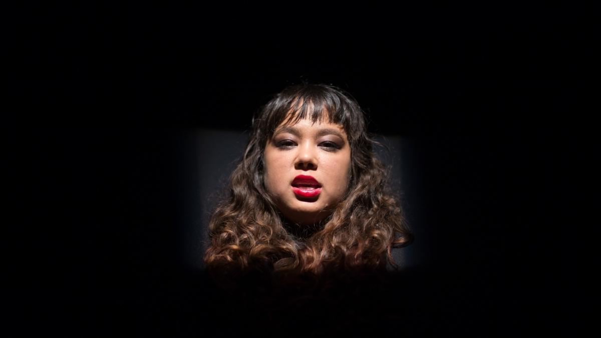 Actress' face in dramatic lighting.